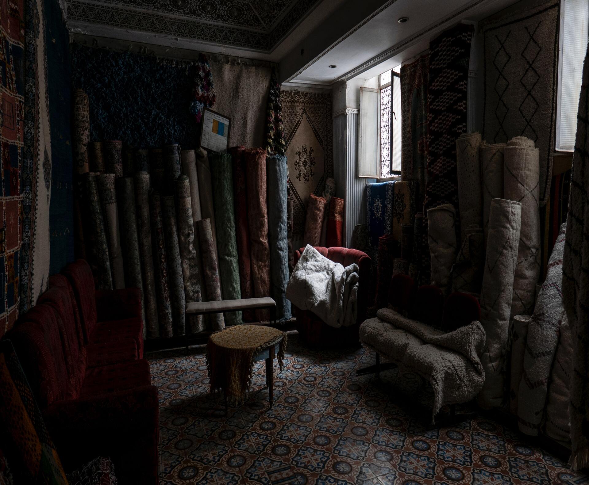 A collection of handmade rugs in a rug showroom